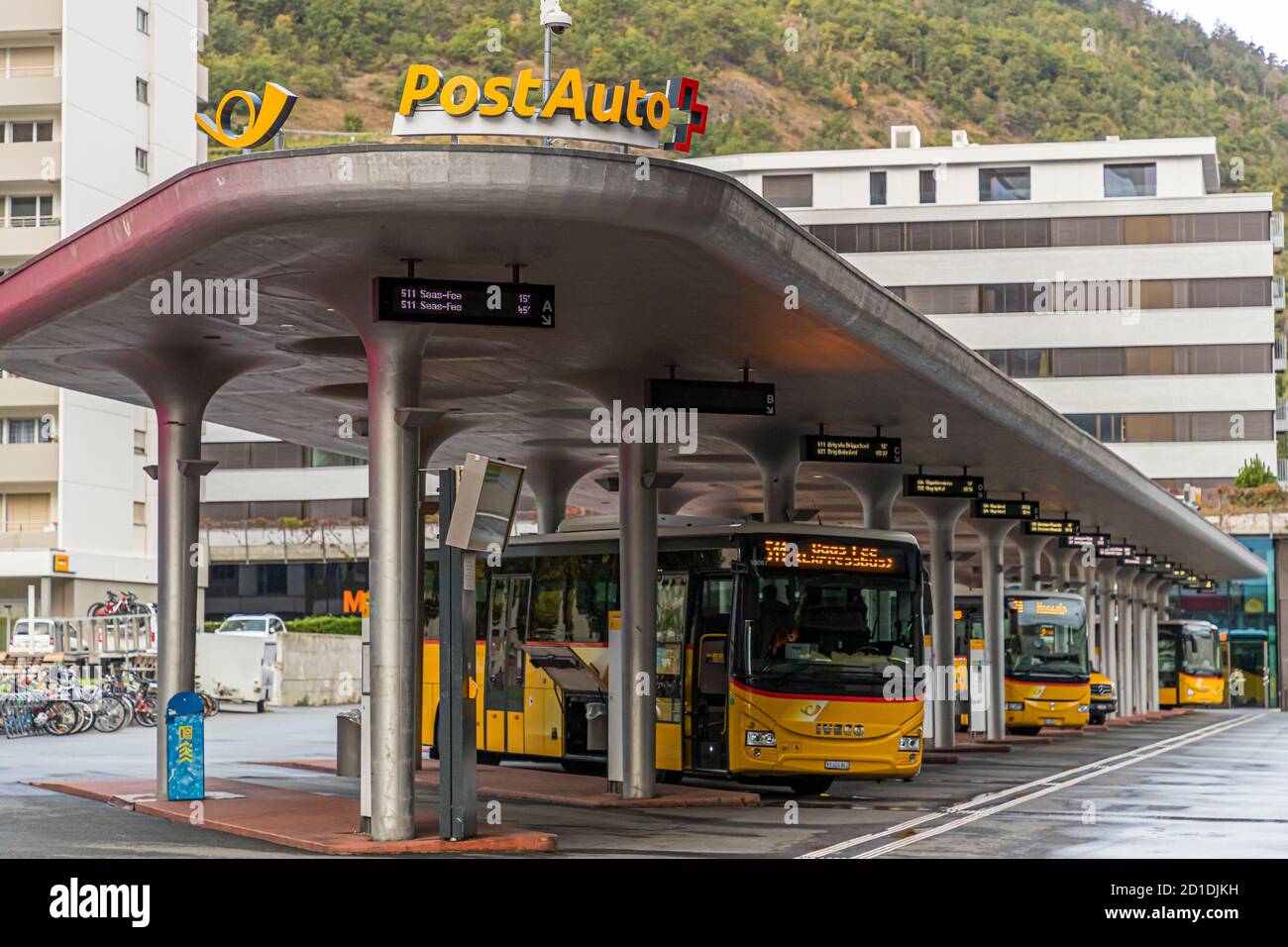 The Swiss post bus terminates in the Valais city of Visp, Switzerland Stock Photo