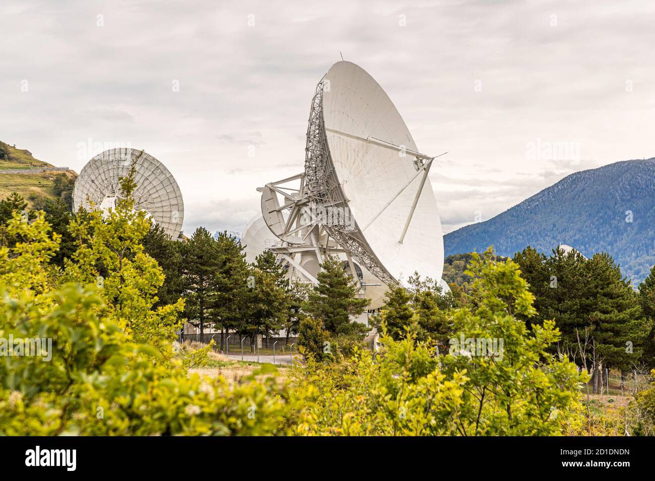 Signal horn ground station with parabolic antennas and satellite dishes in Bretjong near Leuk, Switzerland Stock Photo