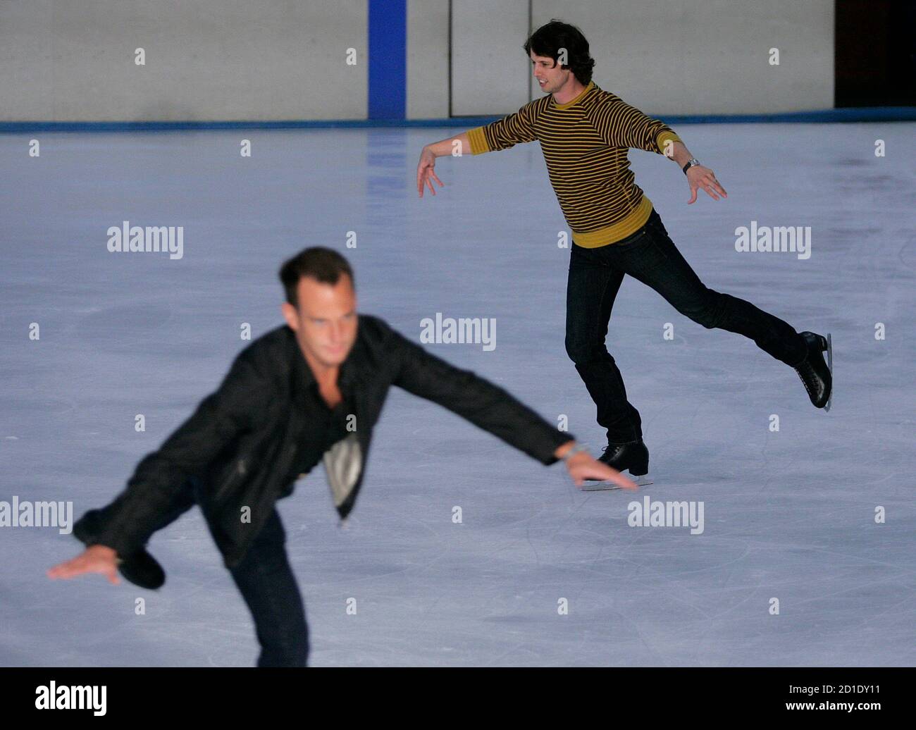 Actors Jon Heder (R) and Will Arnett skate during a media opportunity at an ice skating rink to promote their film "Blades of Glory" in Sydney June 6, 2007.         REUTERS/Tim Wimborne     (AUSTRALIA) Stock Photo