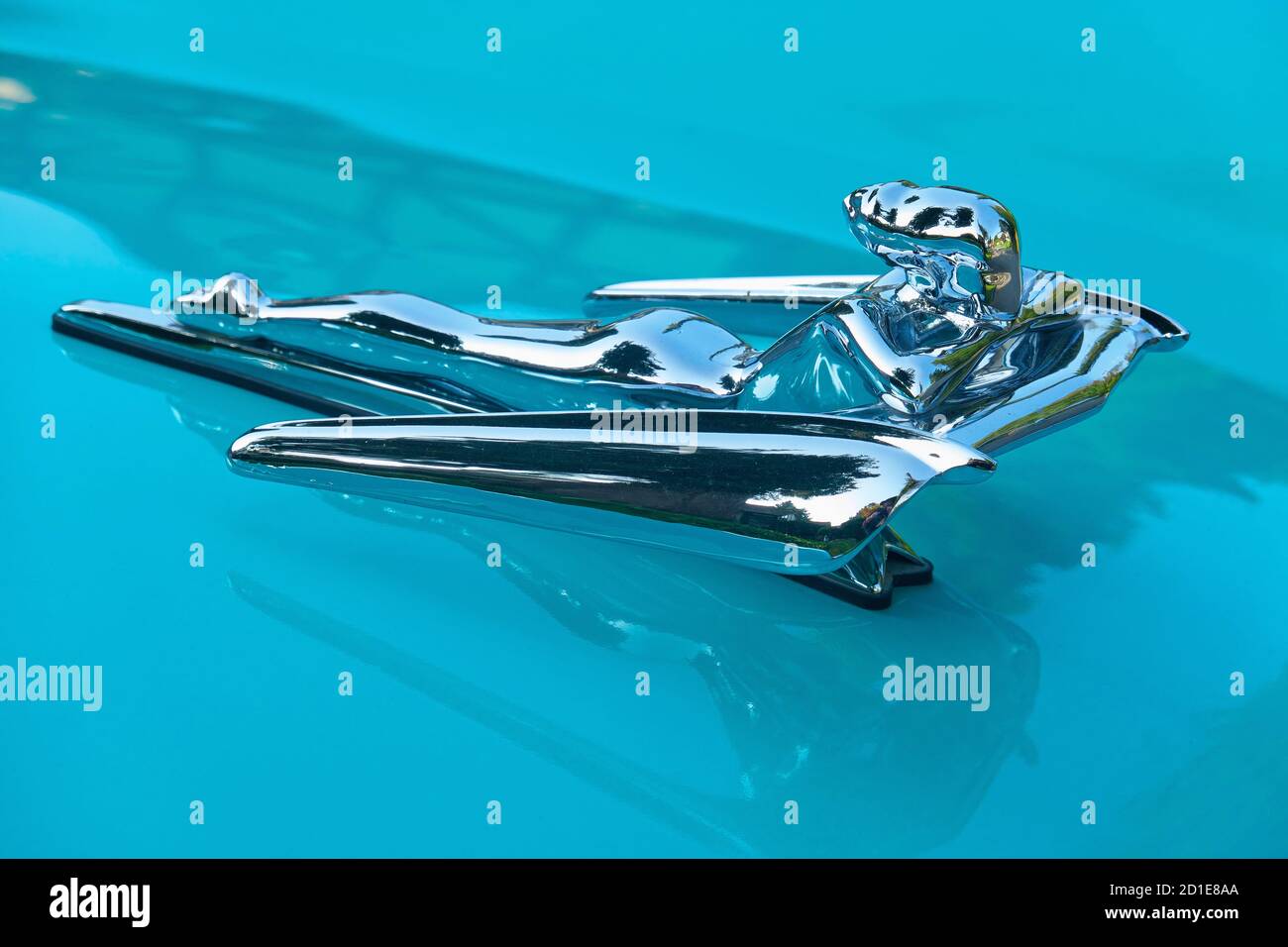 Flying Lady Hood Ornament on a turquoise 1956 Nash Metropolitan Collector Car. Stock Photo