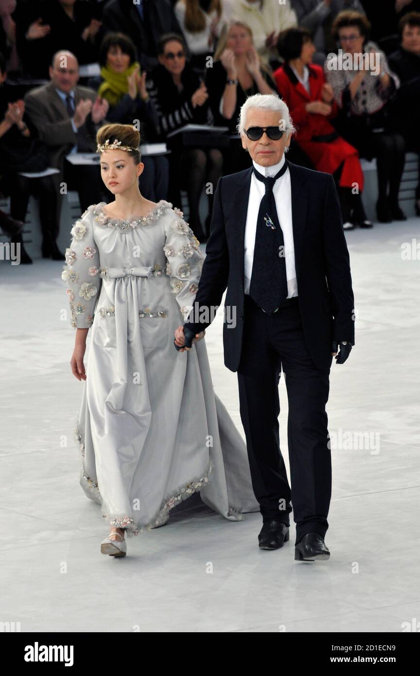 German designer Karl Lagerfeld walks with a model in his wedding dress  creation at the end of his Haute-Couture Spring/Summer 2008 fashion show  for Chanel in Paris January 22, 2008. REUTERS/Philippe Wojazer (