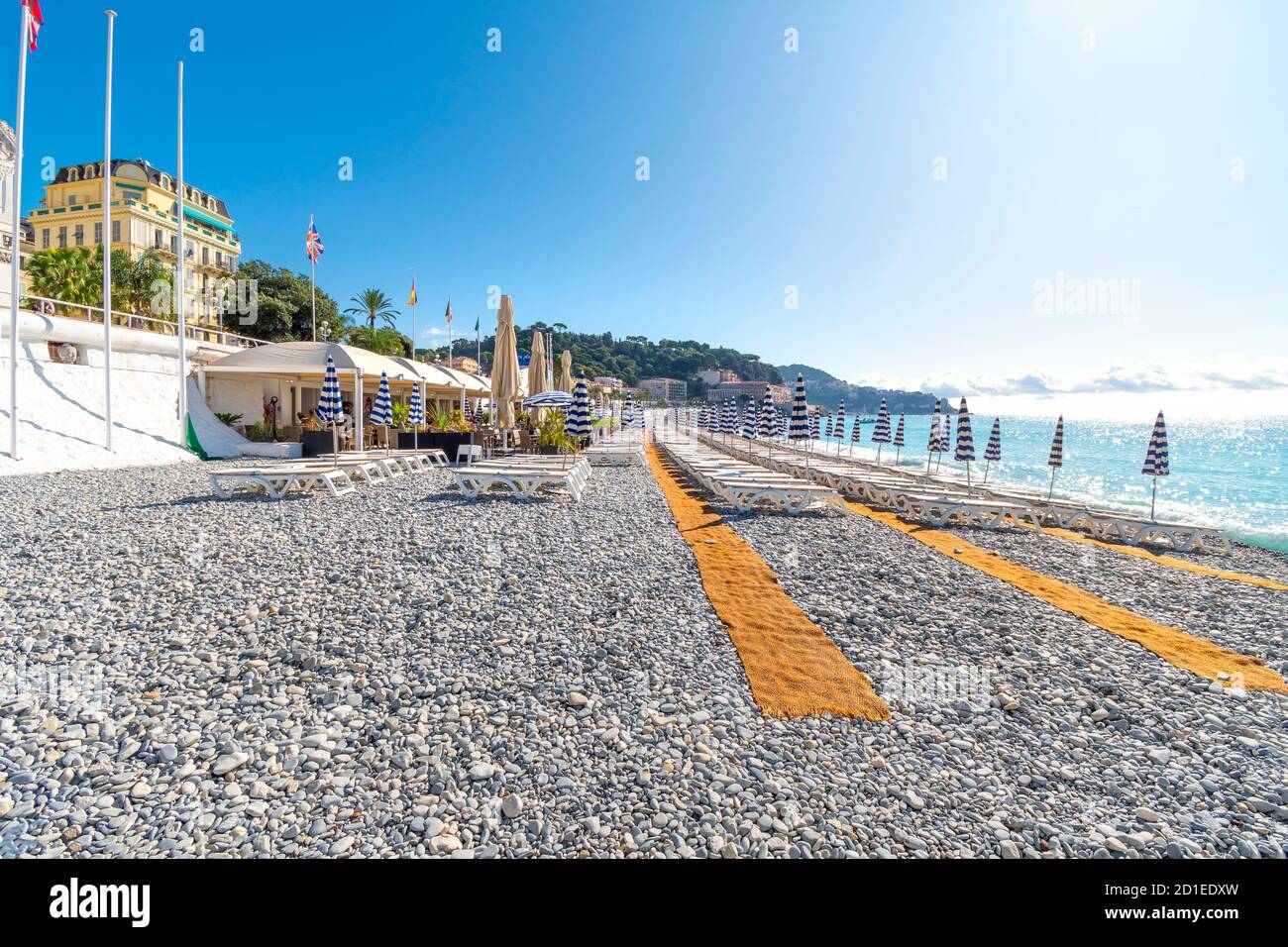 An empty private club along the pebble beach at the Bay of Angels, in the Cote d'Azure area of the French Riviera Stock Photo