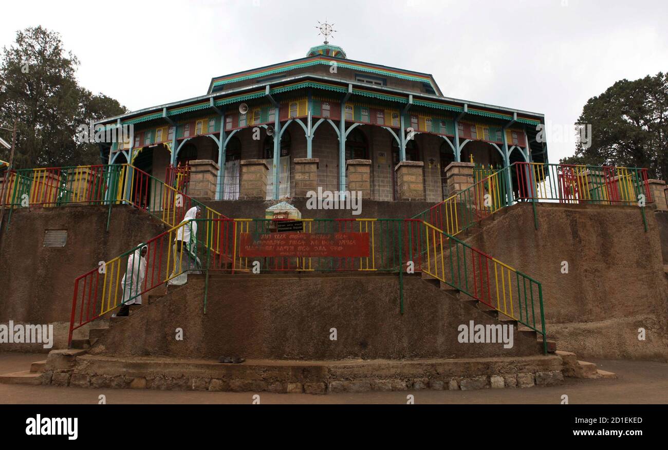 Devotees arrive for a mass at the St. Mary (Mariam) Coptic Orthodox church in Entoto, on the outskirts of Ethiopia's capital Addis Ababa, May 24, 2010. Emperor Menelik II was crowned Emperor of Ethiopia in 1889 in this church. He established the church as part of his effort to build up his new capital Addis Ababa which meant New Flower in English. REUTERS/Thomas Mukoya (ETHIOPIA - Tags: RELIGION) Stock Photo