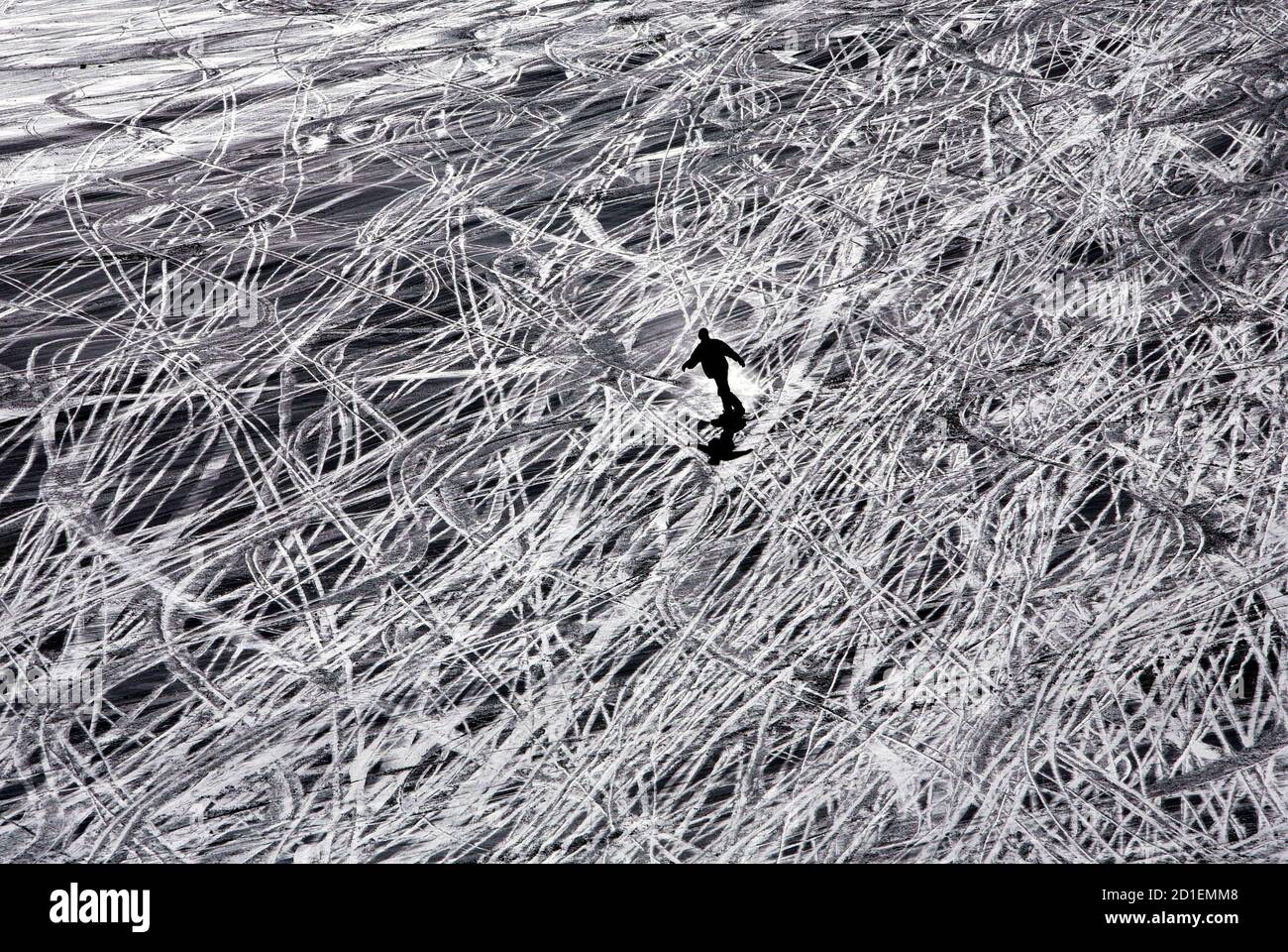 A tourist skis down Maso Corto mountain near the village of Kurzras in Italy January 19, 2006. Stock Photo