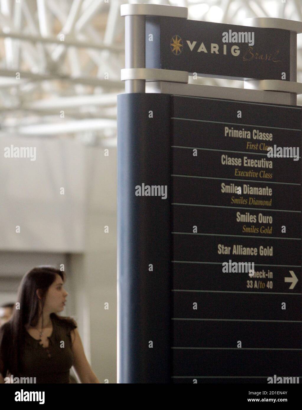 A passenger waits at the check-in counter of Brazilian airline