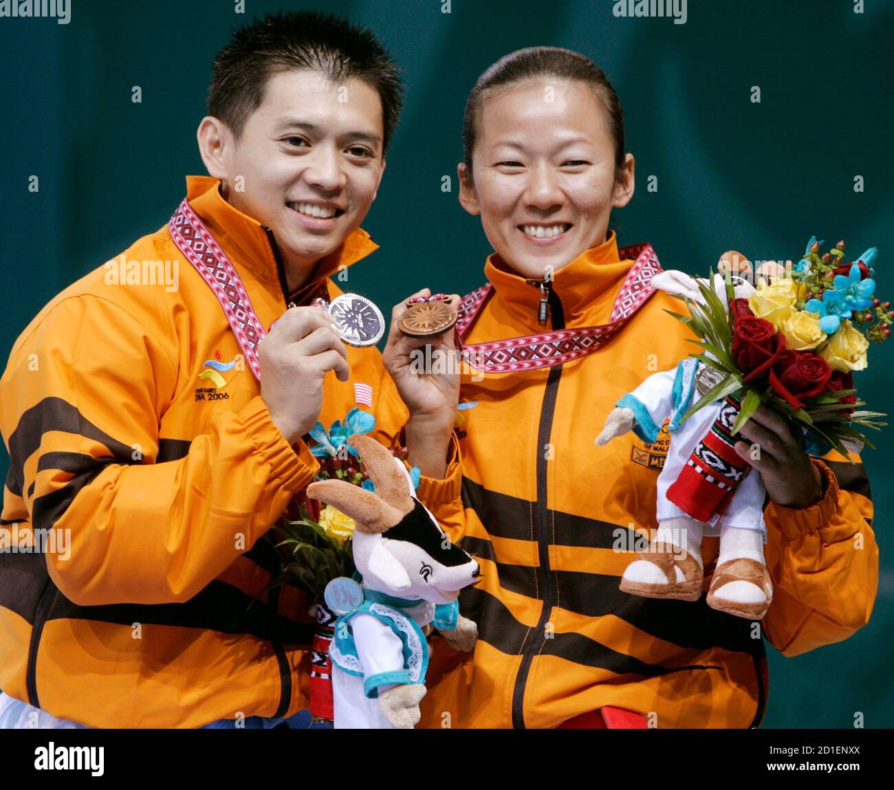 Malaysiau0027s Ku Jin-keat (L) and Lim Lee-lee celebrate with their 