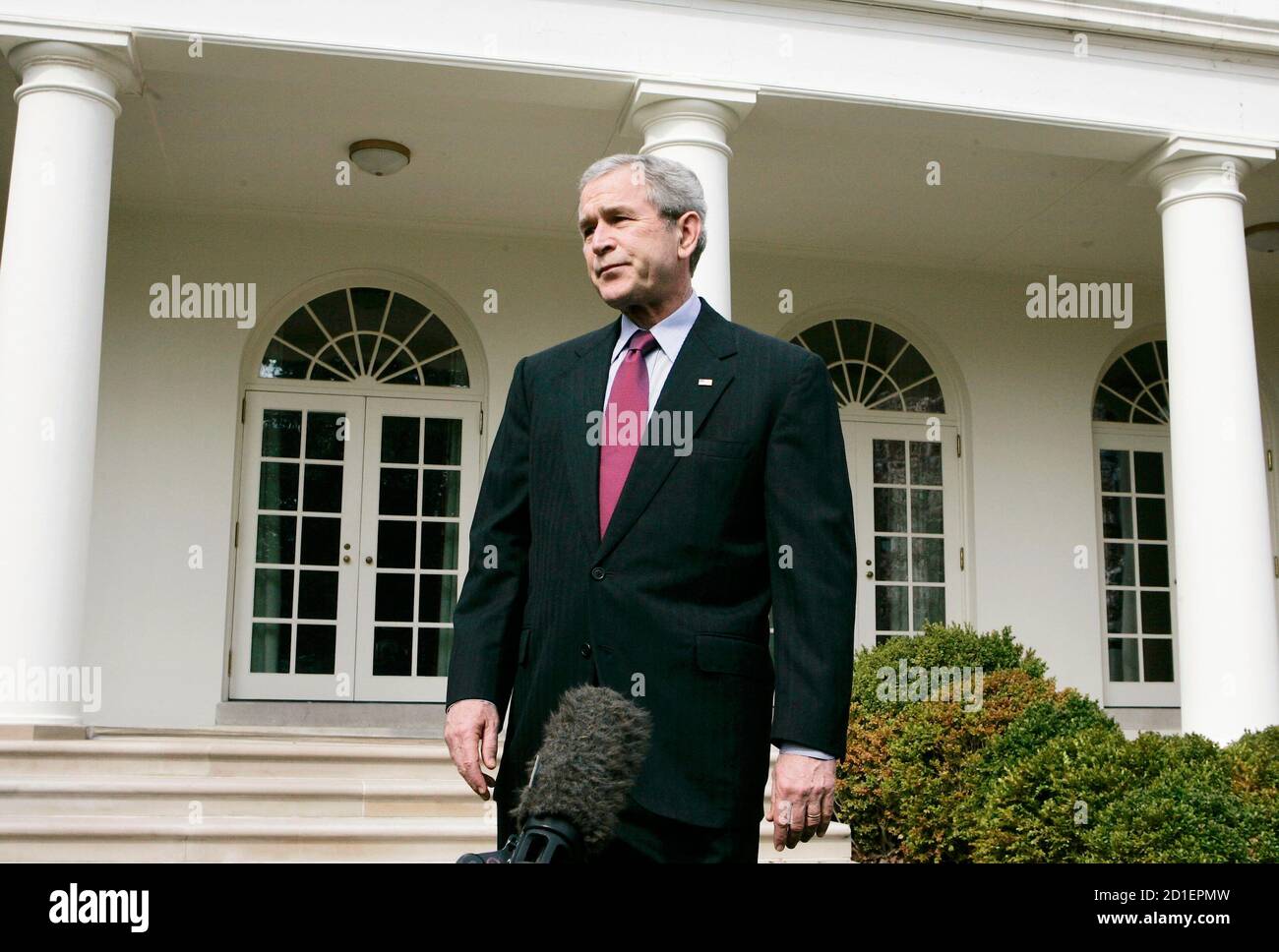 U.S. President George W. Bush talks about Press Secretary Tony Snow's phone call to him on Tuesday morning informing Bush of his reoccurring cancer while in the Rose Garden of the White House in Washington March 27, 2007.    REUTERS/Larry Downing (UNITED STATES) Stock Photo