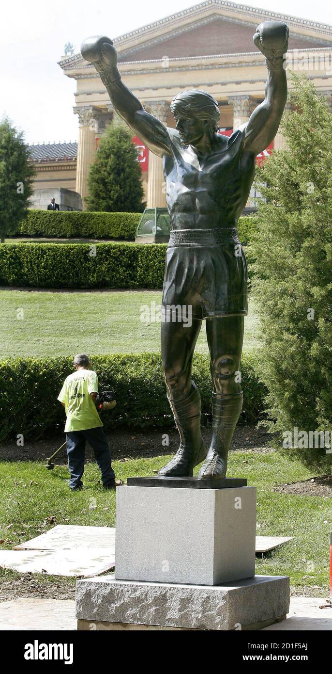 A landscaper works behind the "Rocky" statue near the Philadelphia