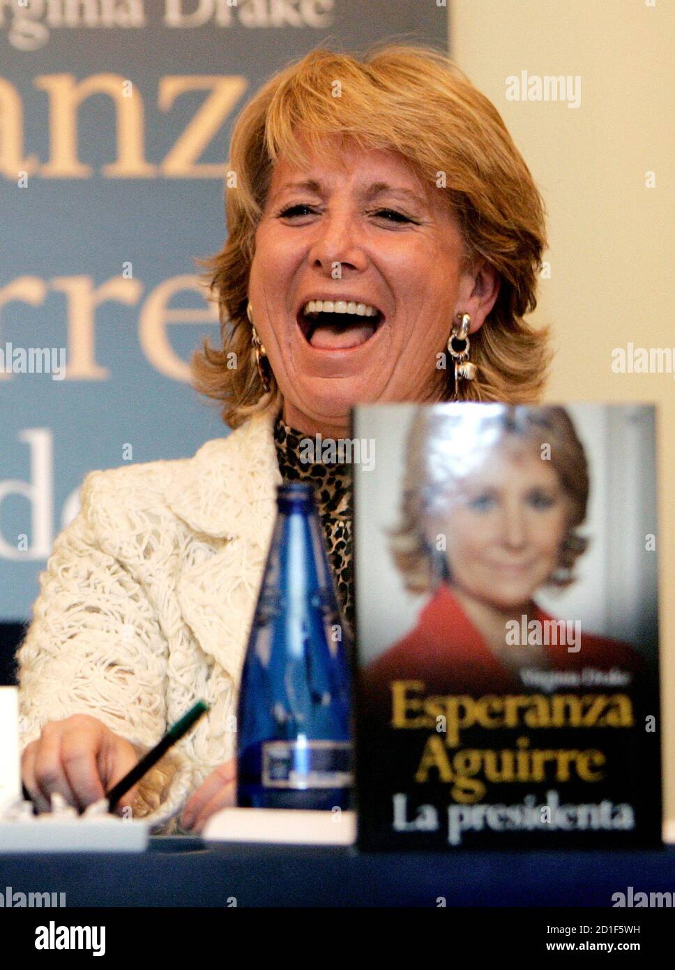 President of Madrid's regional government Esperanza Aguirre laughs during the presentation of her biography 'Esperanza Aguirre La Presidenta' in Madrid November 28, 2006. REUTERS/Andrea Comas (SPAIN) Stock Photo