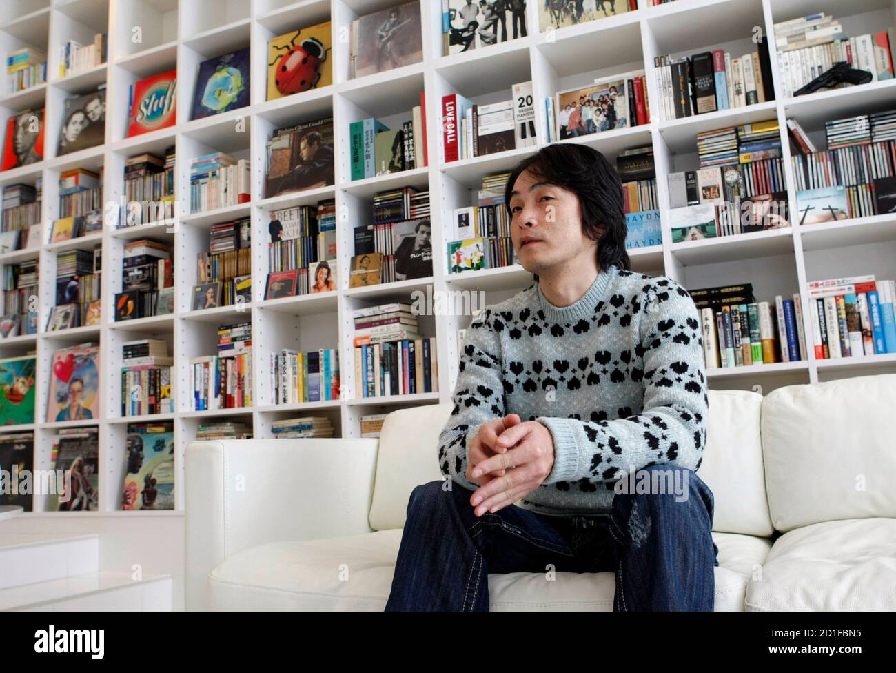 Japanese popular author Ira Ishida speaks during an interview with Reuters at his home in Tokyo December 26, 2008. Picture taken December 26, 2008. REUTERS/Issei Kato (JAPAN) Stock Photo
