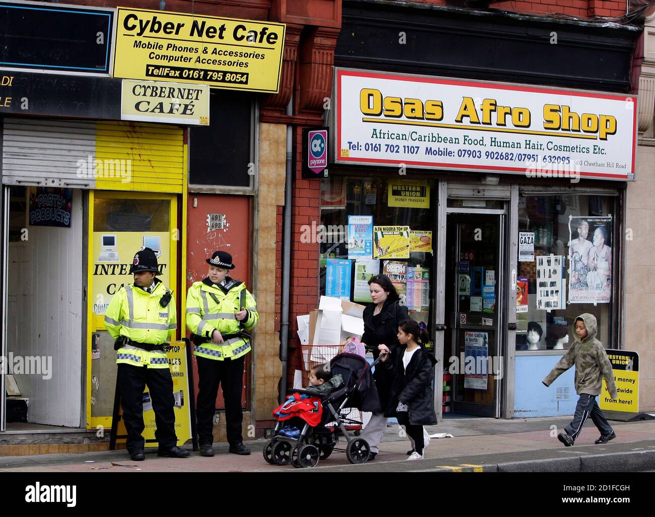 British Police Officers Guard An Internet Cafe In Manchester Northern England April 9 2009 Britain S Most Senior Counter Terrorism Officer Bob Quick Quit On Thursday After His Security Blunder Forced Police To Bring