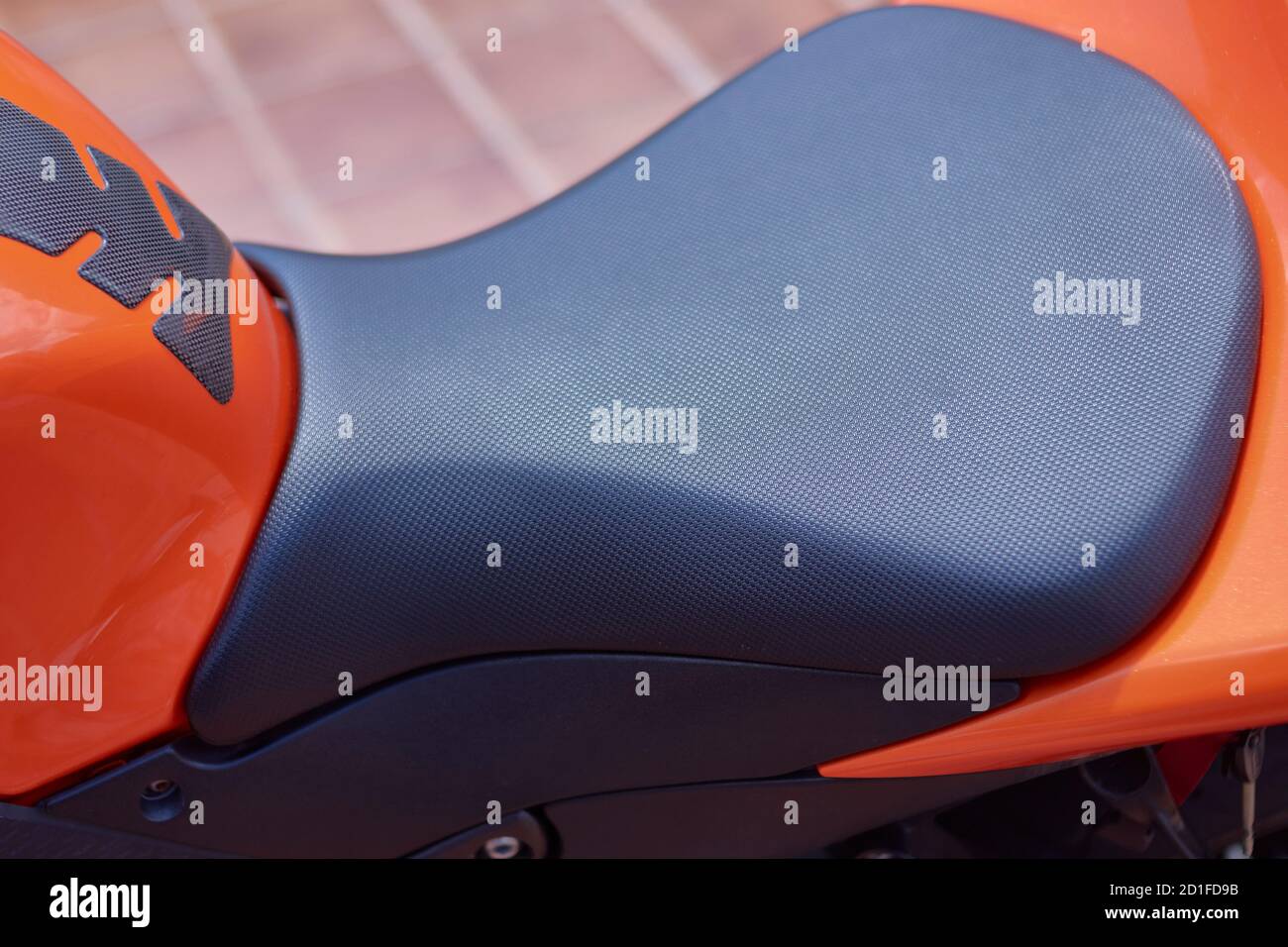 Black textured sports bike seat for increased rider grip and comfort Stock Photo Alamy