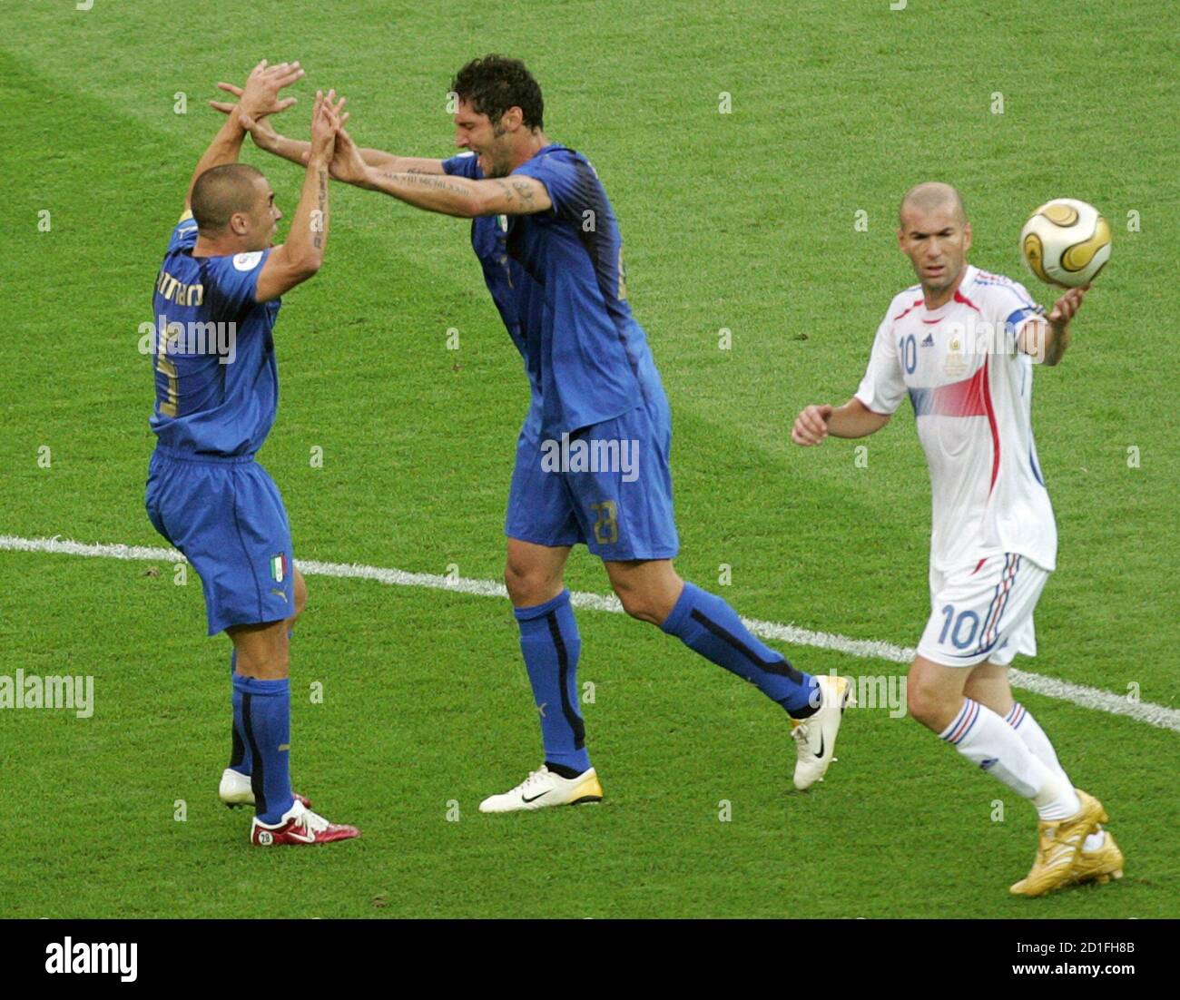 Italy S Marco Materazzi C Celebrates With Team Mate Fabio Cannavaro After Scoring Their First Goal As France S Zinedine Zidane Holds The Ball During Their World Cup 2006 Final Soccer Match In Berlin
