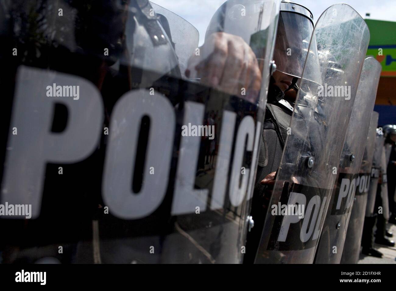 Police Take Cover Behind Riot Shields As They Break Up A Demonstration In Support Of Rctv Broadcasting Station In Caracas January 25 10 Venezuelan Cable Providers Responding To Government Orders Stopped Showing