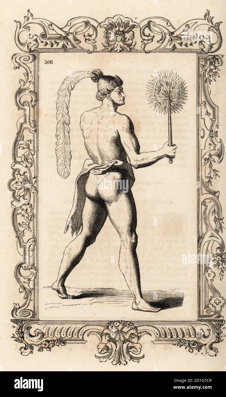 Costume of a Timucua fan bearer, Florida. He wears a long feather in his hair, a loincloth and carries a sunflower fan. Costume des pages. Adapted from an engraving by Theodor de Bry after Jacques le Moyne. Within a decorative frame engraved by H. Catenacci and Fellmann. Woodblock engraving by Gerard Seguin and E.F. Huyot after Christoph Krieger from Cesare Vecellio’s Costumes anciens et modernes, Habits antichi et moderni di tutto il mondo, Firman Didot Ferris Fils, Paris, 1859-1860. Stock Photo