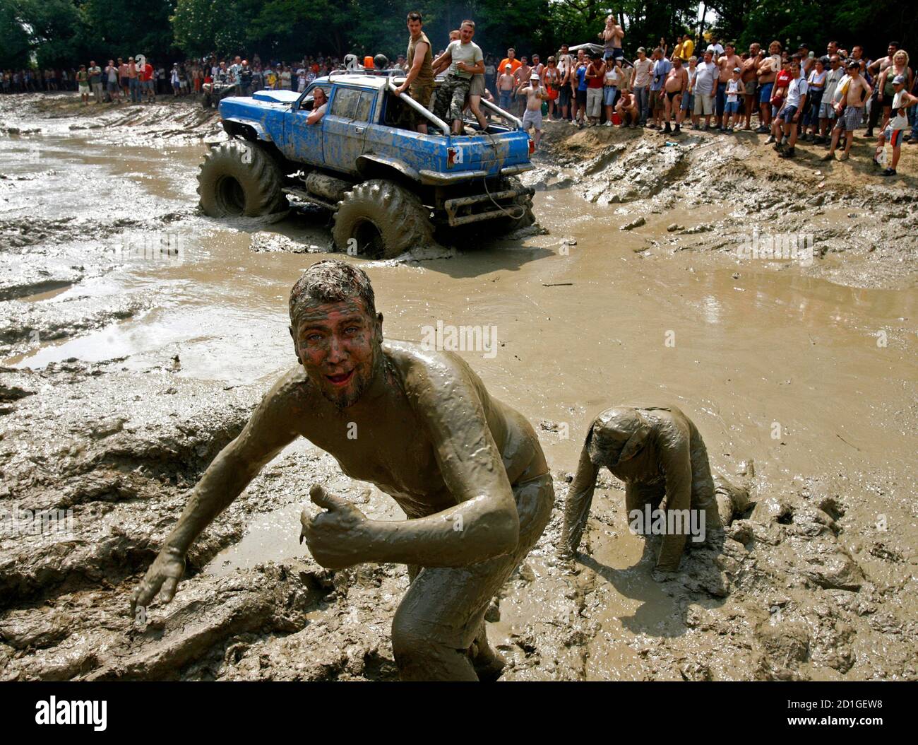 Hungarian youths are covered in mud during the Off Road Festival in  Somogybabod, 165 km (102 miles) south-west of Budapest, May 26, 2007.  REUTERS/Laszlo Balogh (HUNGARY Stock Photo - Alamy