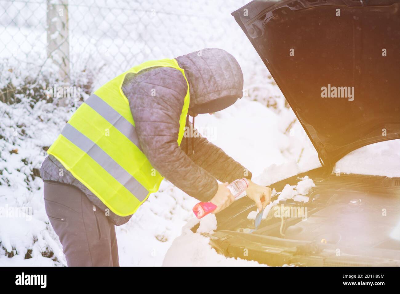 Pouring antifreeze coolant in radiator hires stock photography and