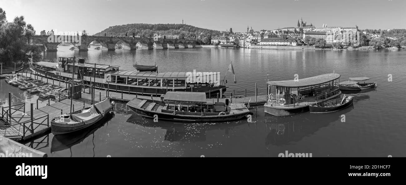 Prague - Charles bridge, castle and cathedral with the little harbor at the morning light. Stock Photo