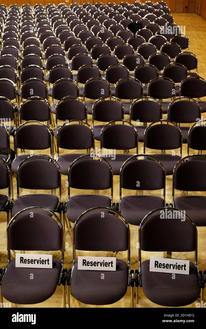 Hundreds of chairs reserved for plaintiffs are seen in the court room prior  to the opening of a trial against German telecommunication giant Deutsche  Telekom in Frankfurt, April 7, 2008. The class