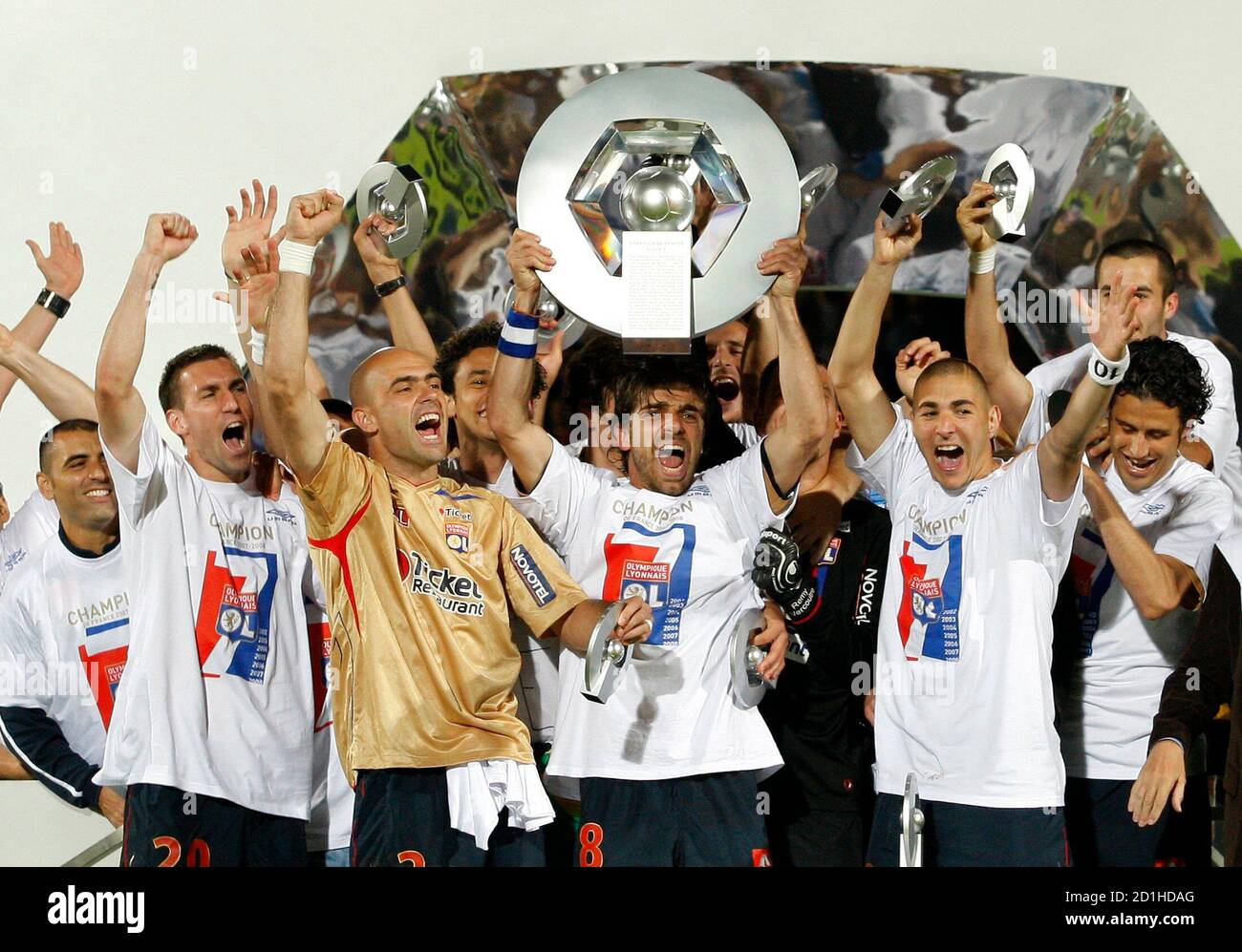 Olympique Lyon players celebrate winning the French Ligue 1 title following  their soccer match against AJ Auxere at the l'Abbe Deschamps stadium in  Auxerre May 17, 2008. Olympique Lyon wrapped up a