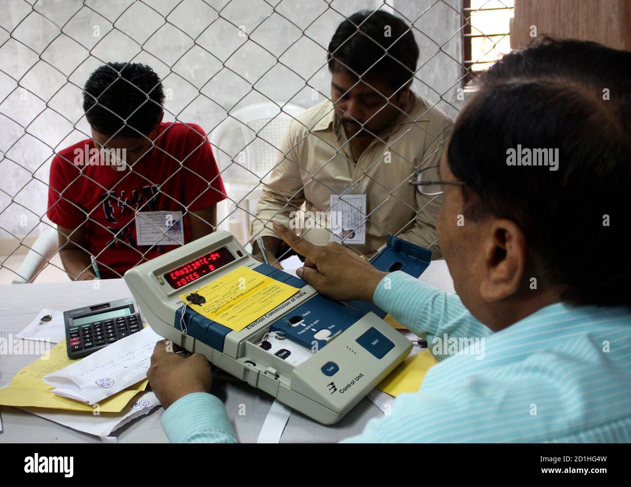 An Election Official R Prepares To Count Ballots Inside A Counting Centre In Gandhinagar 25 Km 16 Miles North Of The Western Indian City Of Ahmedabad May 16 2009 Prime Minister Manmohan