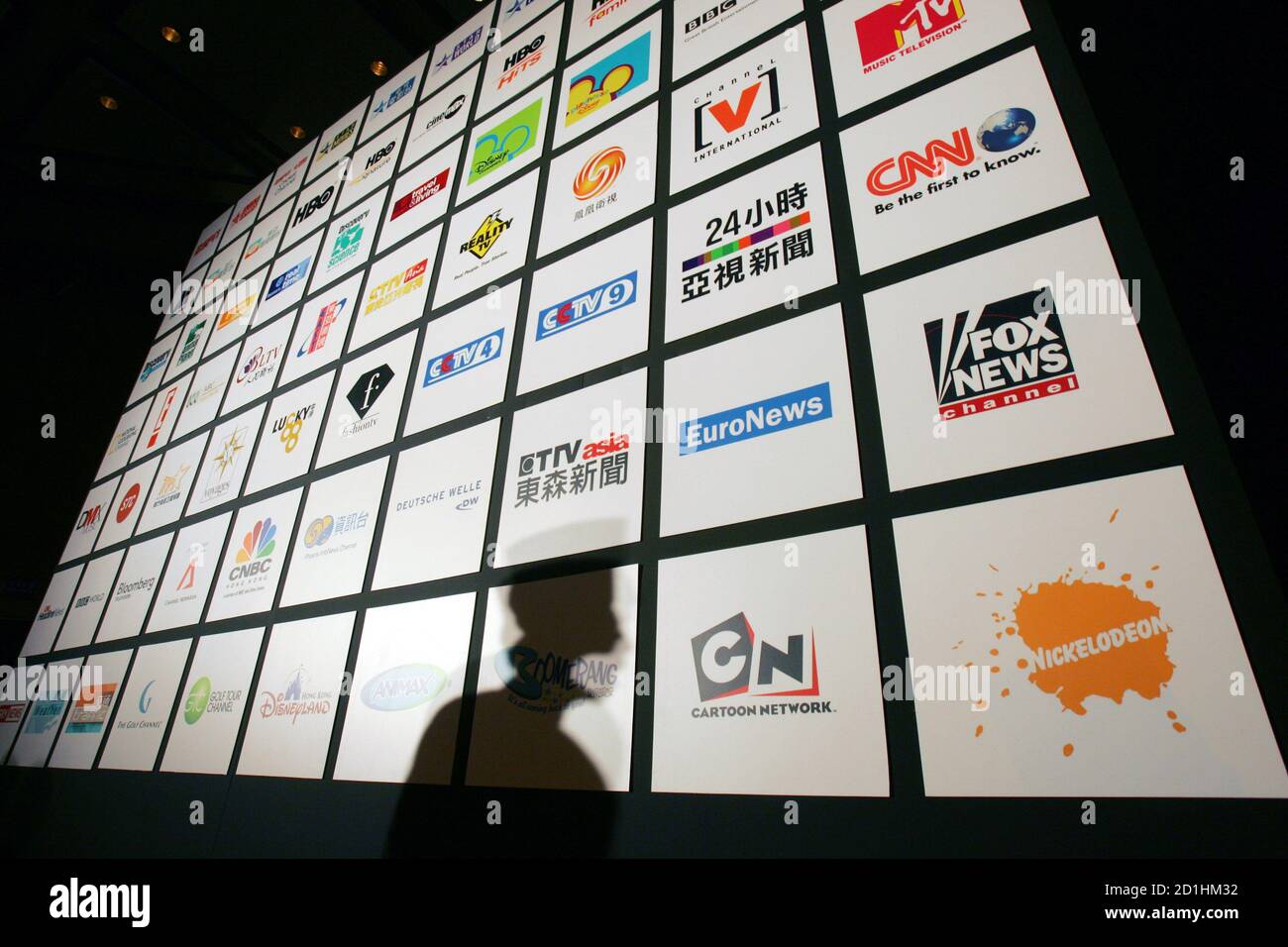 An advertistment displays channels of NOW TV during the launch ceremony of NOW  TV's 24-hour Business News Channel in Hong Kong March 20, 2006. The pay TV  service, owned by Hong Kong