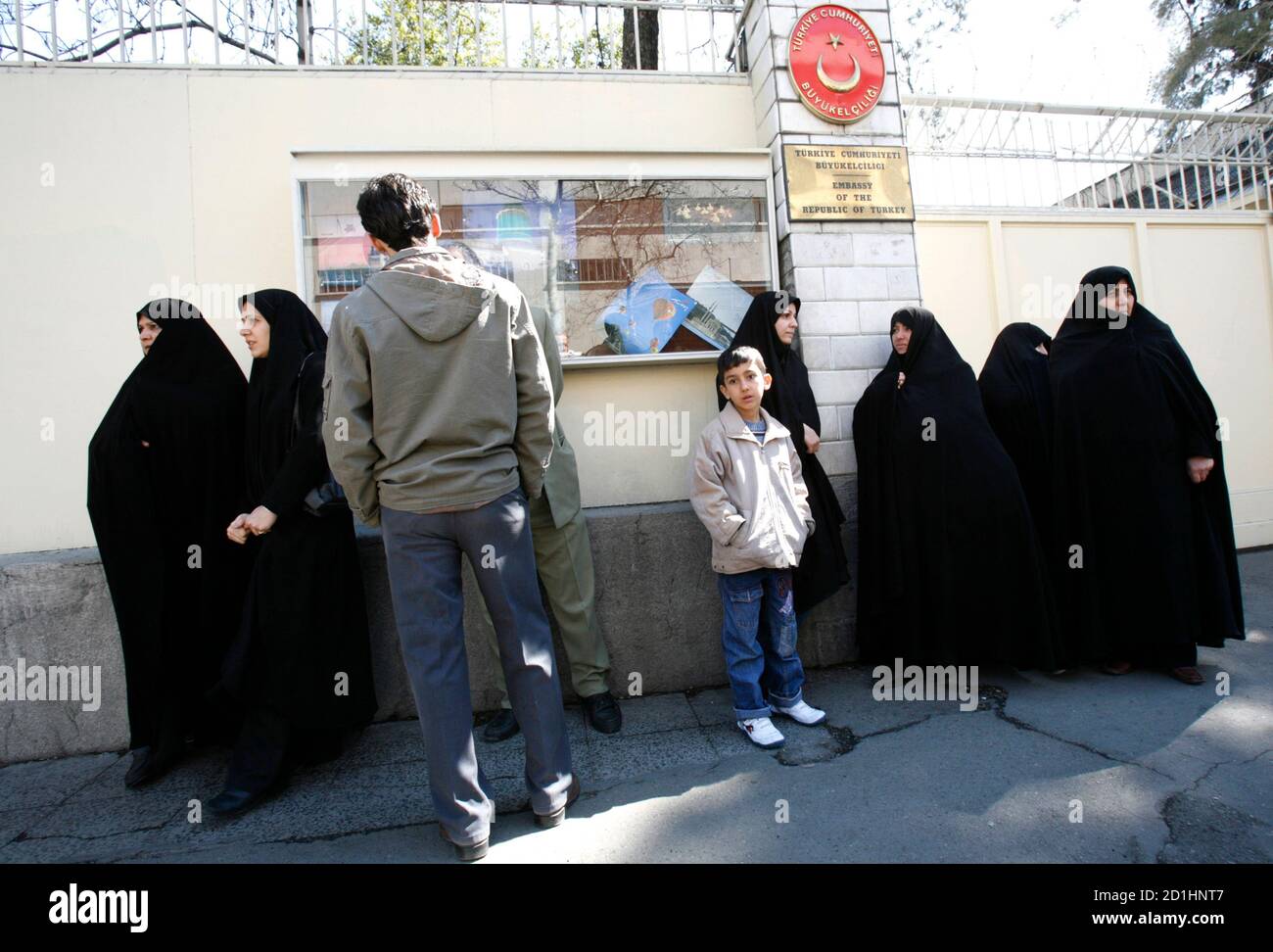 Family members of Iran's ex-deputy defense minister Ali Reza Asgari, including his wives (at R and 3rd R), gather in front of the Turkish Embassy in Tehran March 19, 2007. Asgari disappeared after checking into an Istanbul hotel on February 7.  REUTERS/Raheb Homavandi (IRAN) Stock Photo