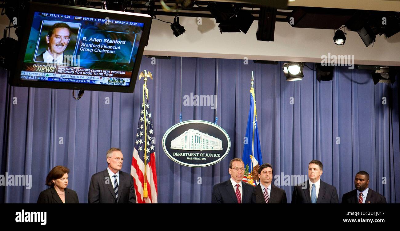 Assistant Attorney General for the Criminal Division at the U.S. Department of Justice Lanny Breuer (3rd L) announces indictments against Chairman of the Stanford Financial Group Allen Stanford in Washington June 19, 2009. Texas billionaire Stanford and four associates were indicted on fraud, conspiracy and obstruction charges in a $7 billion pyramid scheme to bilk investors, U.S. Justice Department officials announced on Friday. With Breuer are (from L) Chief of Internal Revenue Service - Criminal Investigation Eileen Mayer, US Attorney of the Southern District of Texas Tim Johnson, Director  Stock Photo