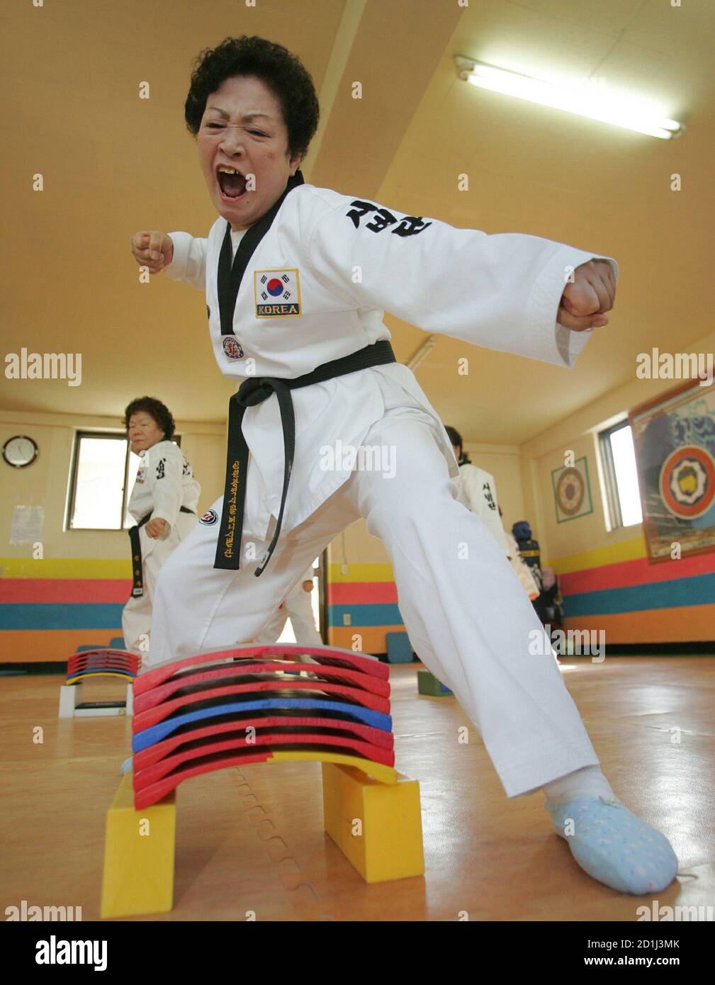PHOTO TAKEN 09FEB06- South Korean woman, 67-year-old Lee Jung-sook, practices Taekwondo at a gymnasium in Inchon, west of Seoul in this picture taken February 9, 2006. [At 74, there are several things PHOTO TAKEN 09FEB06- South Korean woman, 67-year-old Lee Jung-sook, practices Taekwondo at a gymnasium in Inchon, west of Seoul in this picture taken February 9, 2006. [At 74, there are several things