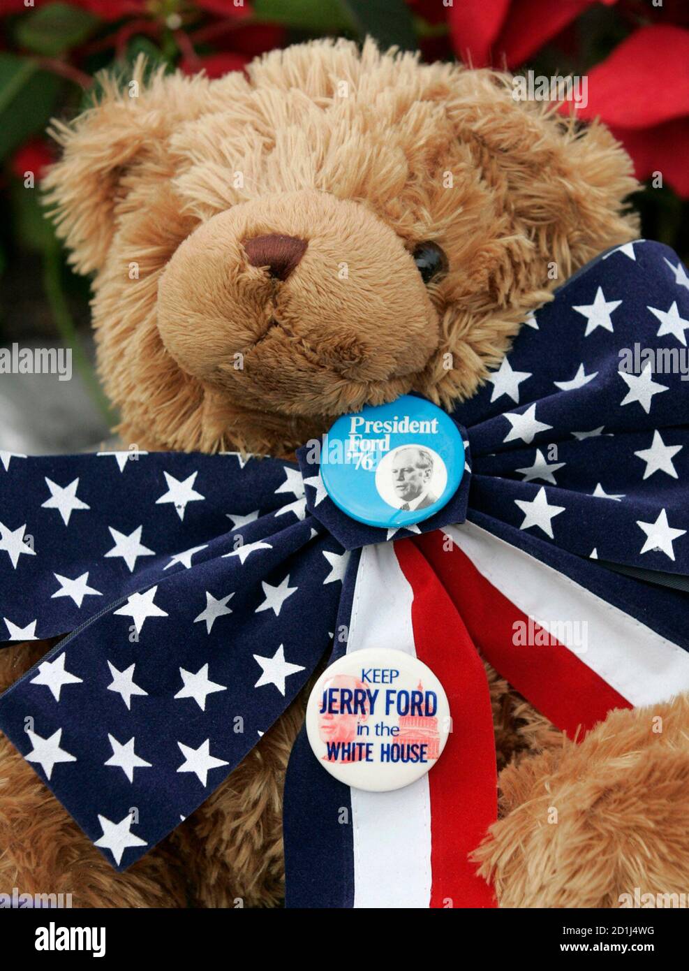 A teddy bear with political buttons sits at a memorial outside the Gerald R. Ford Museum in Grand Rapids, Michigan where people left items in memory of the former president, December 27, 2006.   The oldest living president at 93, Ford died on December 26 of undisclosed causes at his home in California.     REUTERS/Molly Riley   (UNITED STATES) Stock Photo