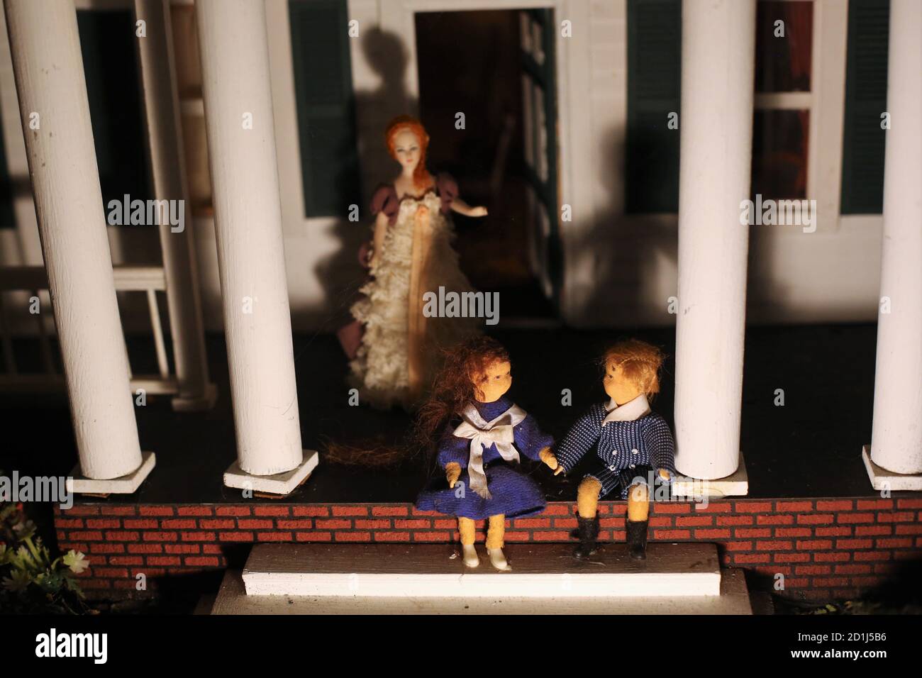 Creepy old dolls in a plantation style dollhouse Stock Photo Alamy