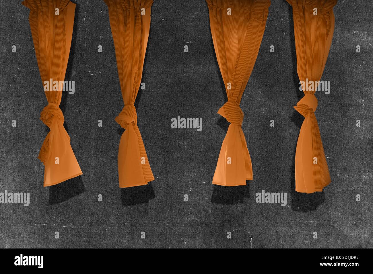 Orange curtain with black wall background Stock Photo