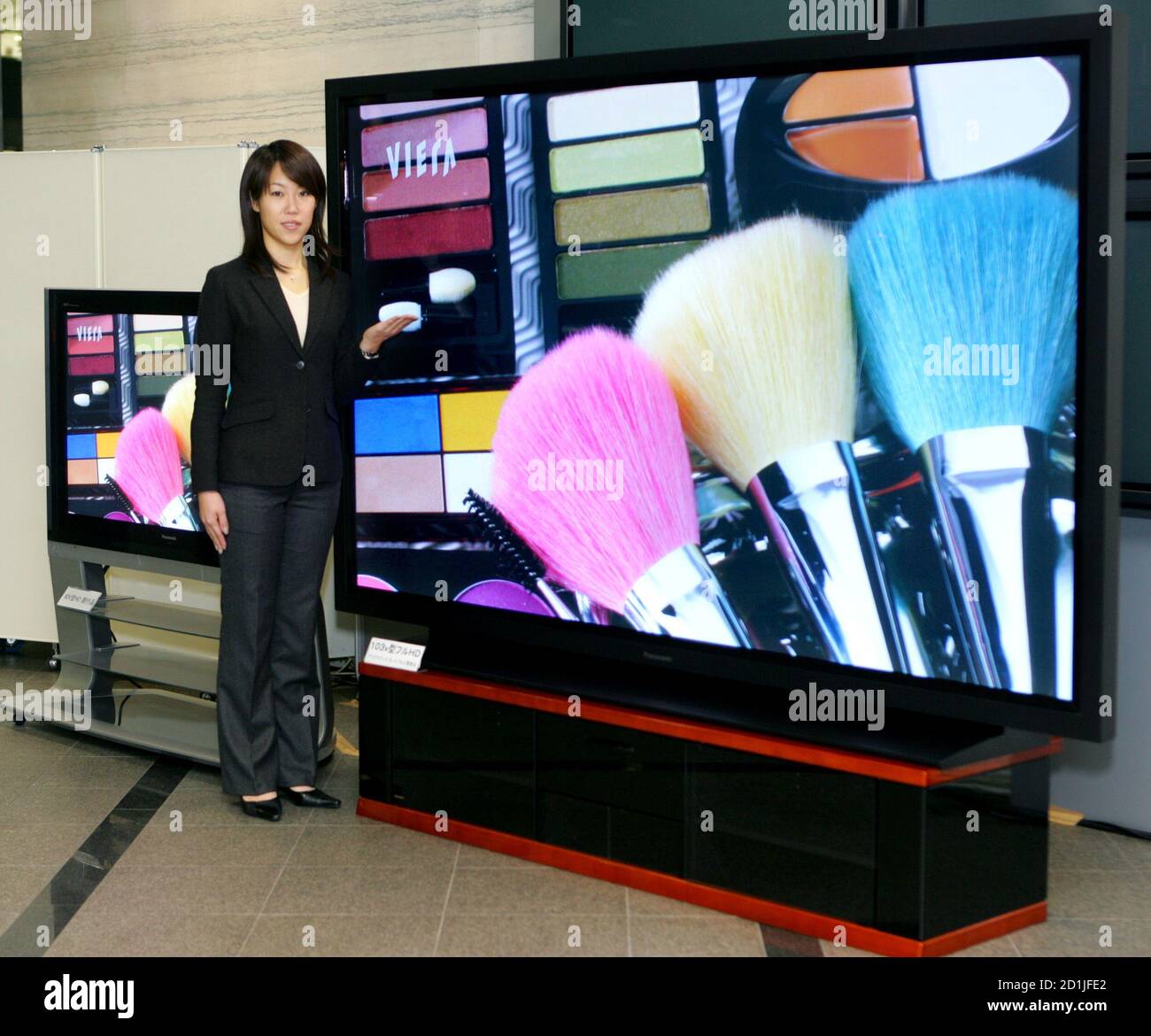 Japan's Matsushita Electric Industrial Co. Ltd. official Satoko Kubo  presents its world's largest 103-inch plasma display panel (PDP) in Tokyo  February 2, 2006. Matsushita posted its highest quarterly profit in 14 years