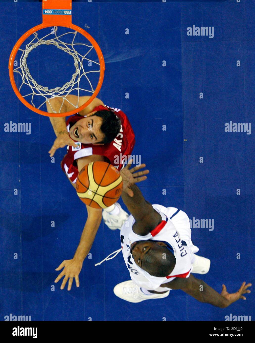 Turkey's Ender Arslan (L) and France's Sacha Giffa fight for a rebound during their second round game at the European Basketball Championships in Madrid September 12, 2007. REUTERS/Victor Fraile (SPAIN) Stock Photo