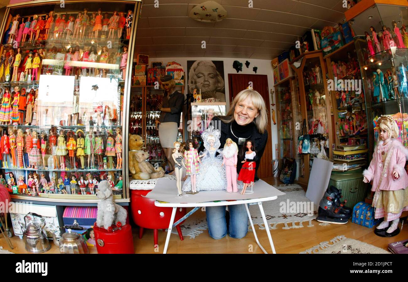 Bettina Dorfmann poses with Barbie dolls from the 50s, 60s, 90s, 70s and  80s (L-R) in Duesseldorf February 3, 2009. Dorfmann owns more than 6,000  Barbie dolls and has one of the