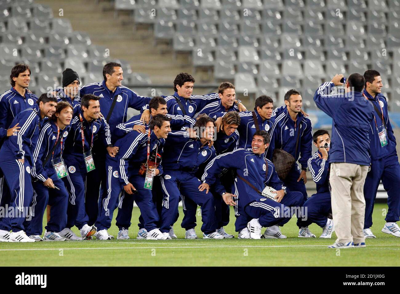 Members of Paraguay's national soccer team pose for a group picture during a visit to the Green Point stadium in Cape Town June 13, 2010. REUTERS/Carlos Barria (SOUTH AFRICA - Tags: SPORT SOCCER WORLD CUP) Stock Photo