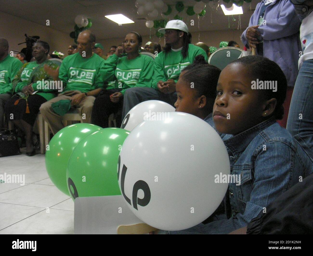A girl holds a balloon at an election rally of Bermuda's ruling Progressive Labour Party in the capital of Hamilton, December 18, 2007. Bermuda is due to hold general elections on Tuesday in which the ruling party is bidding for a third term in office.   REUTERS/Matthew Bigg   (BERMUDA) Stock Photo