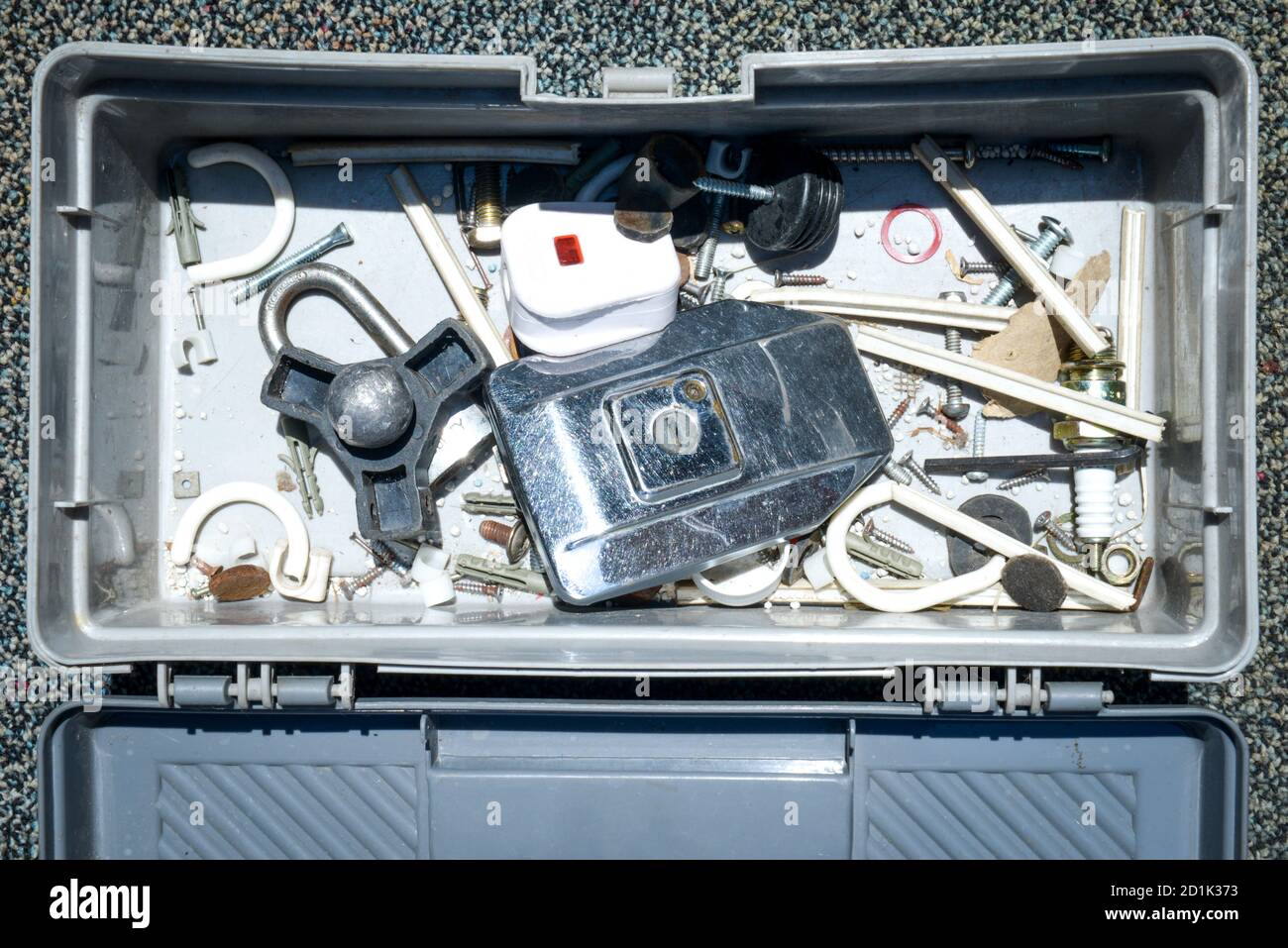 Opened toolbox on the carpet Stock Photo