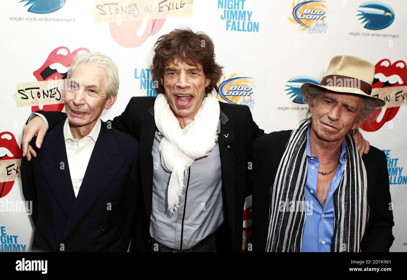 Rolling Stones band members (L-R) Charles Watts, Mick Jagger, and Keith  Richards pose as they arrive for the premiere of the documentary film " Stones In Exile" in New York May 11, 2010.