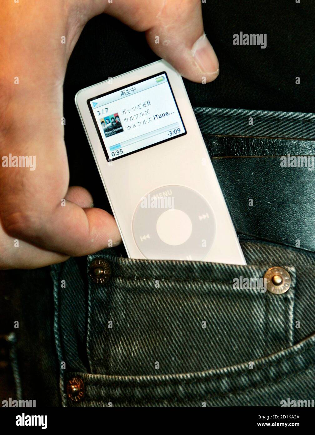 An Apple Computer Inc Employee Pulls Out The New Digital Music Player Ipod Nano From His Pocket In Tokyo September 8 05 The Seriously Slimmed Down Pencil Thin Nano Is About A Quarter Of