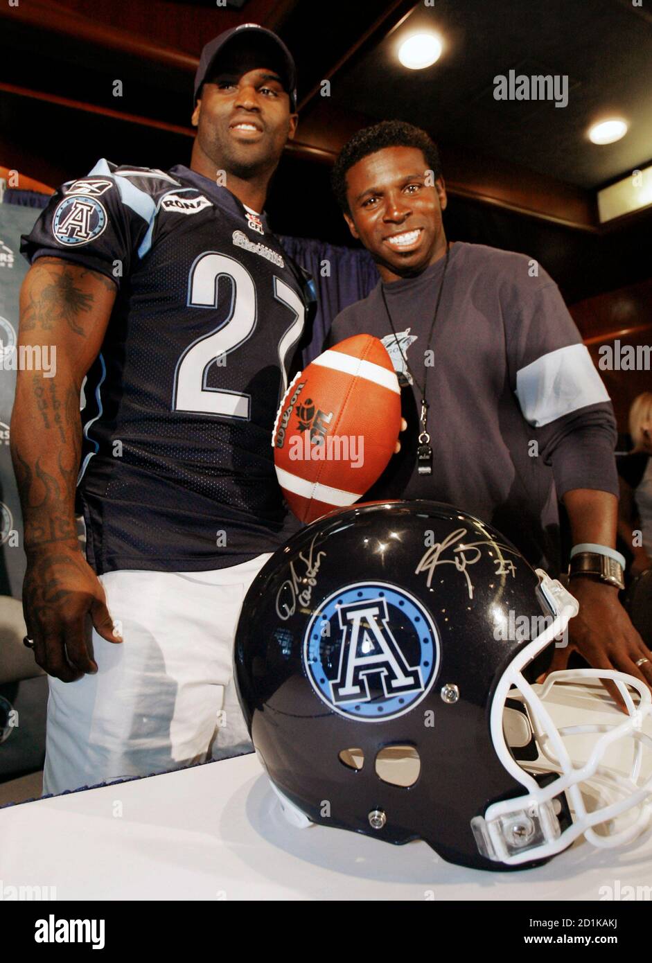 Football Player Ricky Williams (L) Poses With Toronto Argonaut Head Coach Mike "Pinball" Clemons After The Cfl Team Announced William Has Agreed To Play For Them In The Upcoming 2006 Season During
