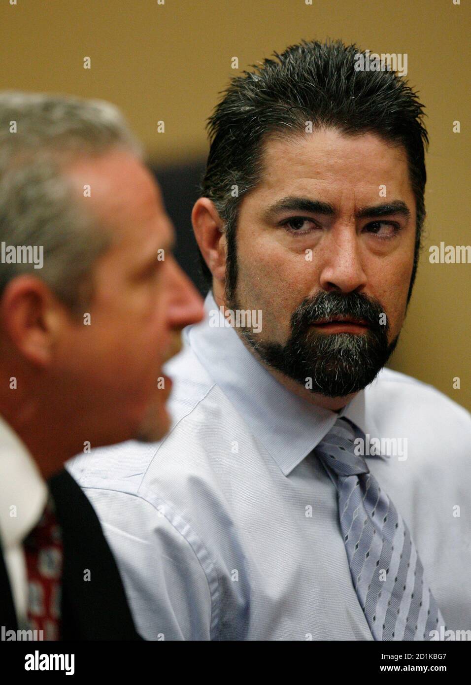 Raymond Lee Oyler (R) listens to his attorney Mark McDonald during his  appearance for a felony settlement conference in Riverside Superior Court  in Riverside, California, December 15, 2006. Oyler is accused of