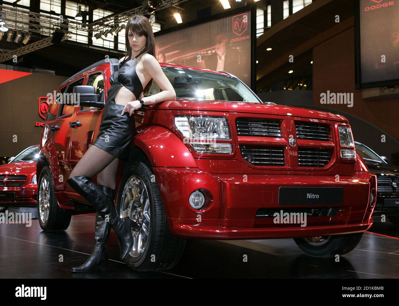 A model poses next to a Dodge Nitro before the opening of the International  Motor Show