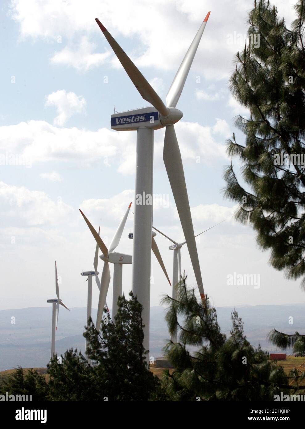 Power-generating wind turbines are seen at the Kenya Electricity Generating Company (KenGen) station in Ngong hills, 22 km (13.7 miles) southwest of Kenya's capital Nairobi, July 17, 2009. Kenya plans to add 2,000 megawatts of more environmentally-friendly energy by 2013 by investing $7-$8 billion, a KenGen official said on Friday. KenGen is setting up some wind turbines and a private company is planning a 300 MW wind farm in Kenya's northeastern region by 2012. To match INTERVIEW KENYA-ENERGY/      REUTERS/Thomas Mukoya (KENYA ENERGY BUSINESS) Stock Photo