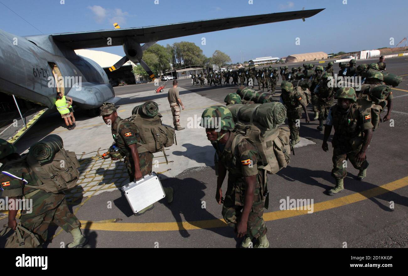 Members of the Eastern Africa Standby Brigade from Uganda queue to board a French tactical aircraft C160 Transall at the French Air Base 188 in Djibouti, December 5, 2009. The EASB is holding the exercise involving 1,500 troops - from Kenya, Uganda, Rwanda, Ethiopia, Sudan, Burundi, Comoros, Seychelles and Somalia. The aim is to build a proper African peackeeping force which will be able to respond to wars/crises throughout the continent and has the backing of major Western powers as this is the first big exercise they are undertaking. REUTERS/Thomas Mukoya (DJIBOUTI CONFLICT POLITICS CRIME LA Stock Photo