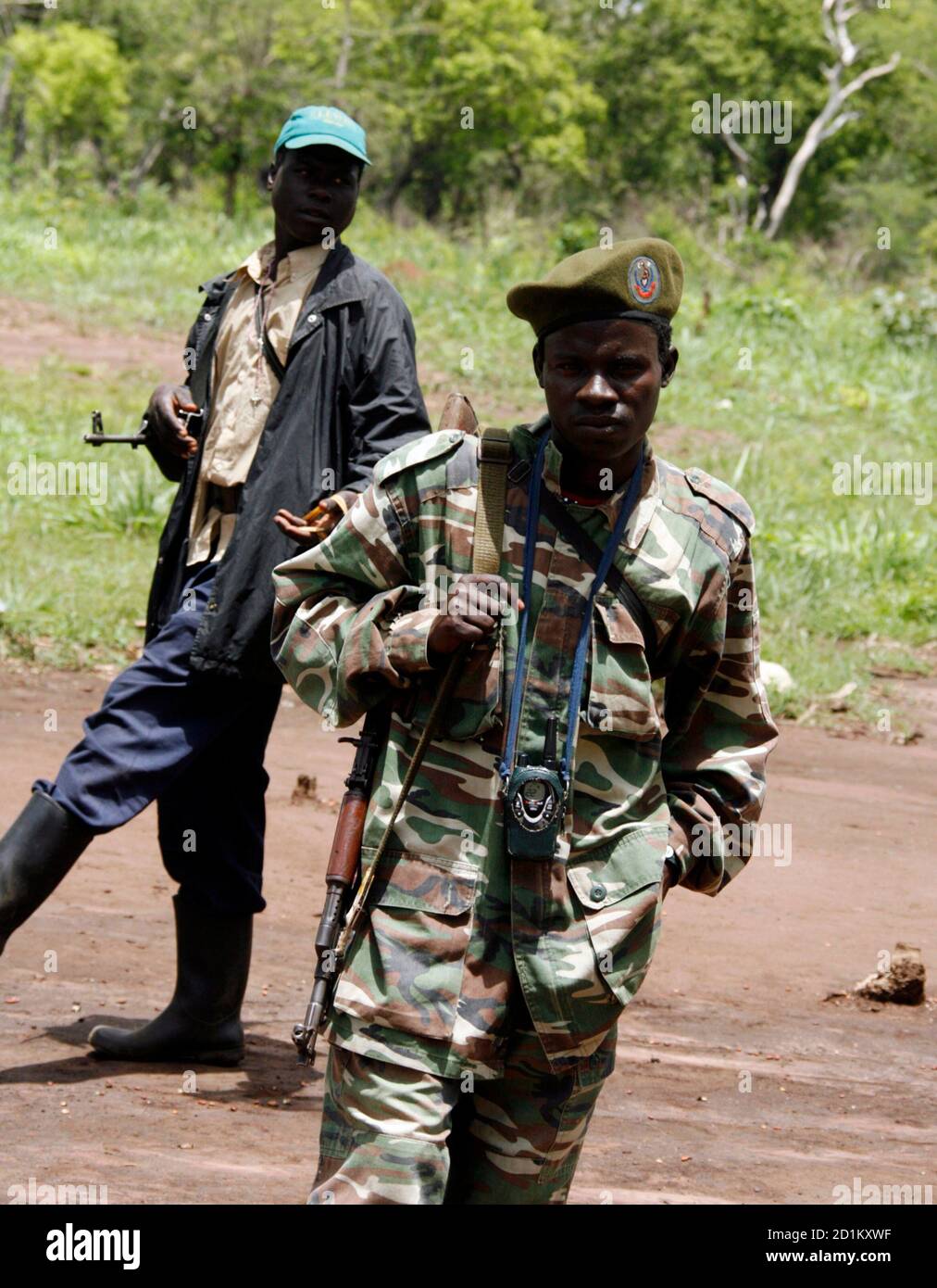 Soldiers from Uganda's Lord's Resistance Army (LRA) keep guard at the assembly point in Ri-Kwangba on the Sudan-Congo border, Western Equatoria, April 10, 2008. Uganda's fugitive rebel commander Joseph Kony delayed signing a final peace deal with the government on Thursday and asked for clarification of some parts of the agreement, mediators said.  REUTERS/Thomas Mukoya (SUDAN) Stock Photo