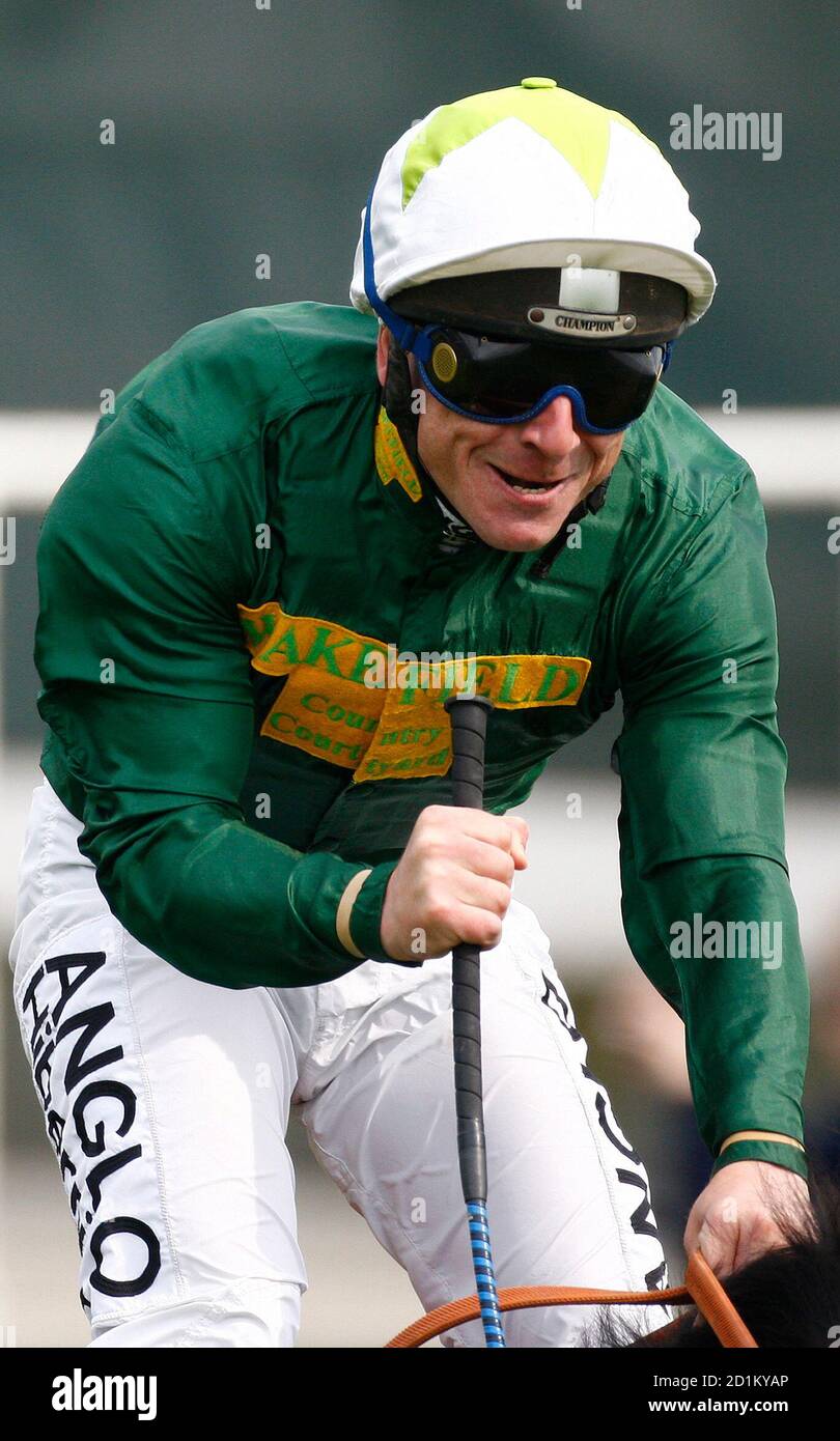 Seb Sanders riding Look Here celebrates as he wins the Oak during the Epsom Derby Festival at Epsom Downs in Surrey, southern England June 6, 2008. REUTERS/Alessia Pierdomenico (BRITAIN) Stock Photo