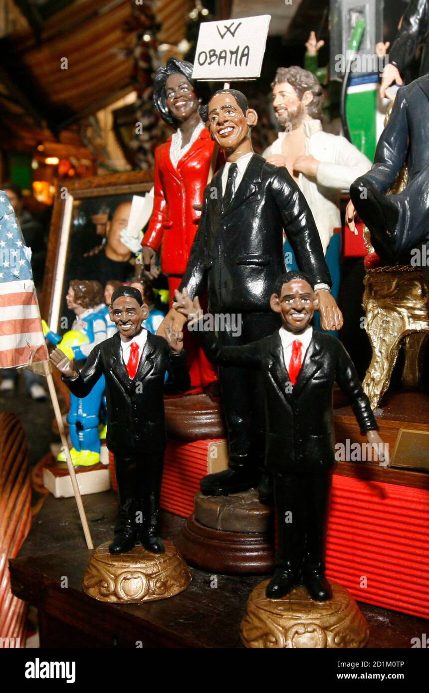 Clay figures of U.S. President-elect Barack Obama and his wife Michelle, for use in Christmas nativity scenes, are seen in a shop in Naples December 10, 2008. Obama and his wife Michelle are appearing in Italian nativity scenes this year, alongside the baby Jesus and wise men, according to Naples craftsmen selling figurines in the run-up to Christmas.     REUTERS/Ciro De Luca/Agnfoto   (ITALY) Stock Photo