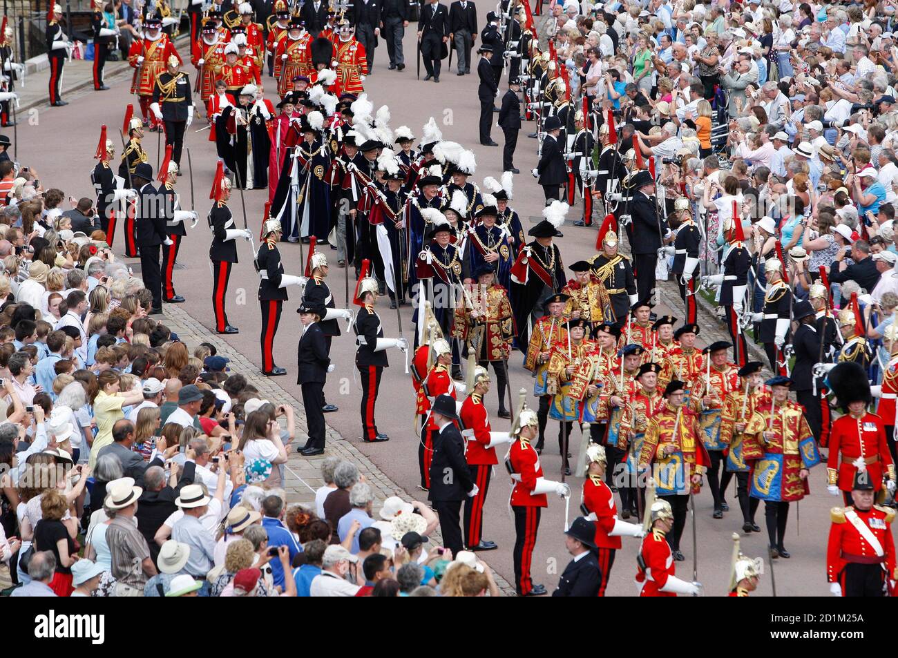 An aerial view shows the procession to attend the Order of the Garter service at St George's Chapel at Windsor Castle in Windsor, southern England, June 15, 2009. Windsor Castle played host to the annual Order of the Garter service, which celebrated the traditions and ideals associated with the Most Noble Order of the Garter.  REUTERS/Kirsty Wigglesworth/Pool  (BRITAIN ROYALS SOCIETY ENTERTAINMENT) Stock Photo