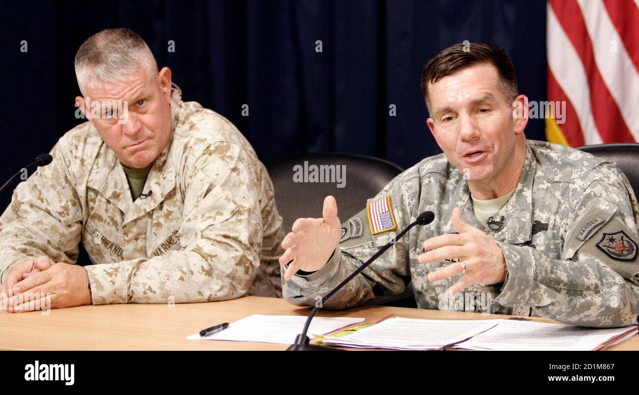 Major-General William B. Caldwell IV (R), Multi-National Force-Iraq Spokesman, speaks to the media in a joint media conference with Brigadier-General C. Mark Gurganus, Commanding General, Ground Combat Element, Multi-National Force-West, at the heavily fortified Green Zone area in Baghdad May 16, 2007. REUTERS/Ali Abbas/Pool  (IRAQ) Stock Photo